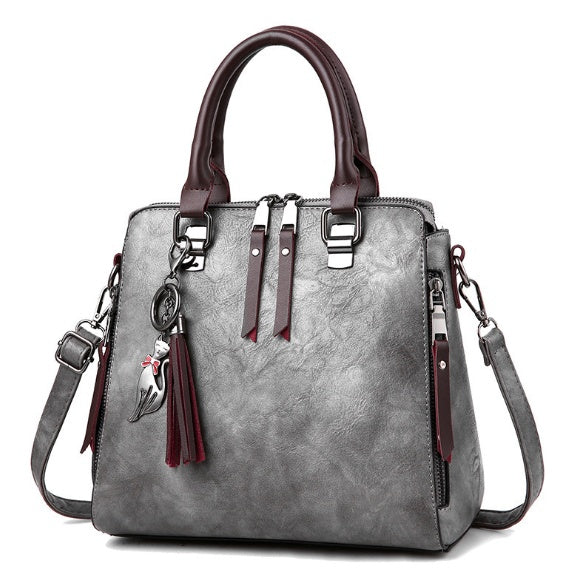 Superior Leather Tassel Cat Pendant Handbag