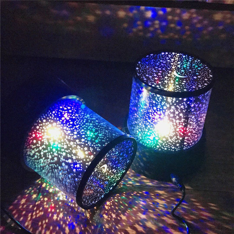 Colorful star projector lamp displaying vibrant light patterns on surfaces, ideal for night relaxation and ambiance.