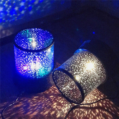 colorful star projector lamp illuminating a dark room with star patterns on walls and ceiling